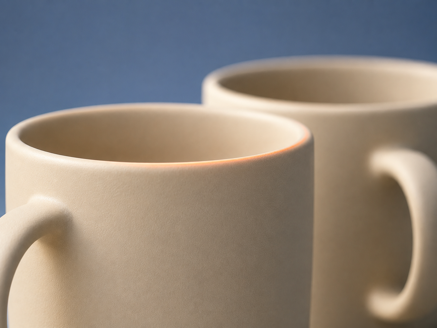 Two mugs side by side, illustrating a working partnership